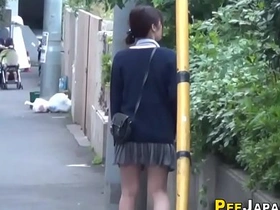 Asian babe pees publicly